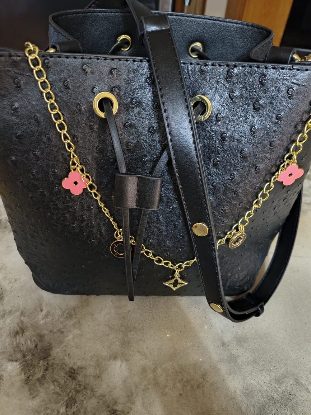 Black Women’s Bucket Bag with Gold Chain and Pink Flower Charms